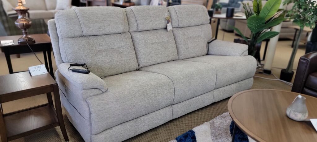 Light gray fabric power reclining sofa on the showroom floor at Meyers Furniture in Rochelle IL