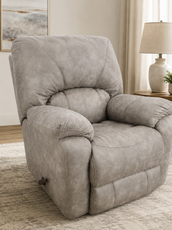 HomeStretch Sapphire manual recliner upholstered in Canyon Fog RELIAPEL fabric with plush pillow arms and padded back.