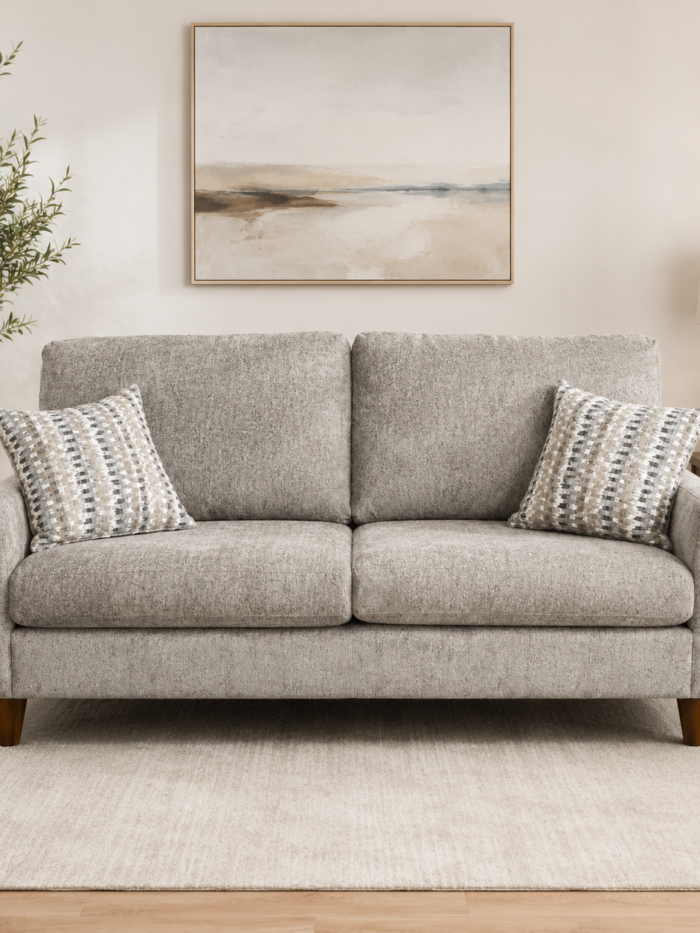 Bestcraft stationary sofa upholstered in Jano Brindle fabric with attached back cushions and decorative accent pillows.