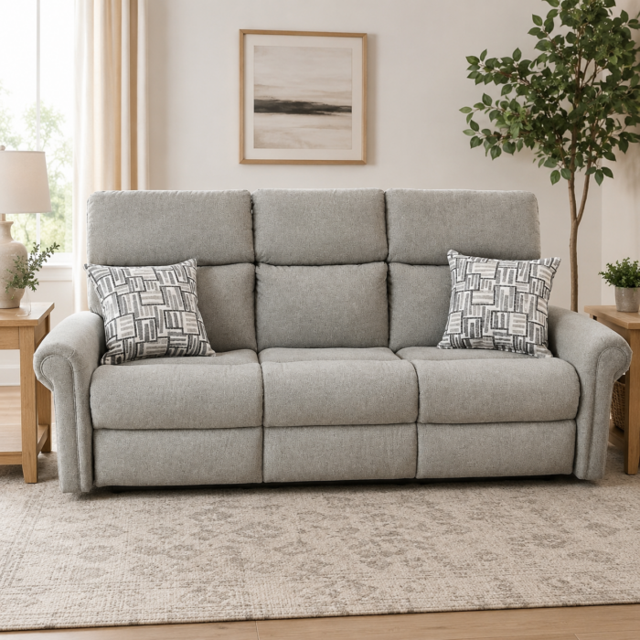 Flexsteel power reclining sofa with adjustable headrests, power lumbar support, and decorative accent pillows in a light neutral fabric.