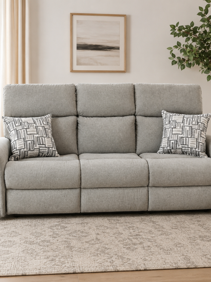 Flexsteel power reclining sofa with adjustable headrests, power lumbar support, and decorative accent pillows in a light neutral fabric.