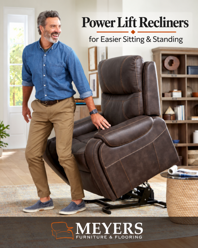 Man standing beside a brown power lift recliner at Meyers Furniture