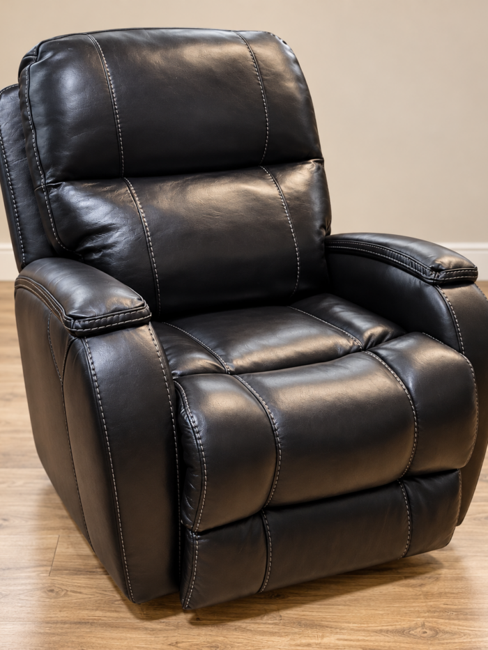 HomeStretch black recliner with slim padded arm tops and light contrast stitching around the back and seat
