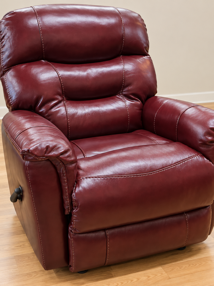 HomeStretch burgundy recliner with pillow arms, tiered back cushions, contrast stitching and a side lever