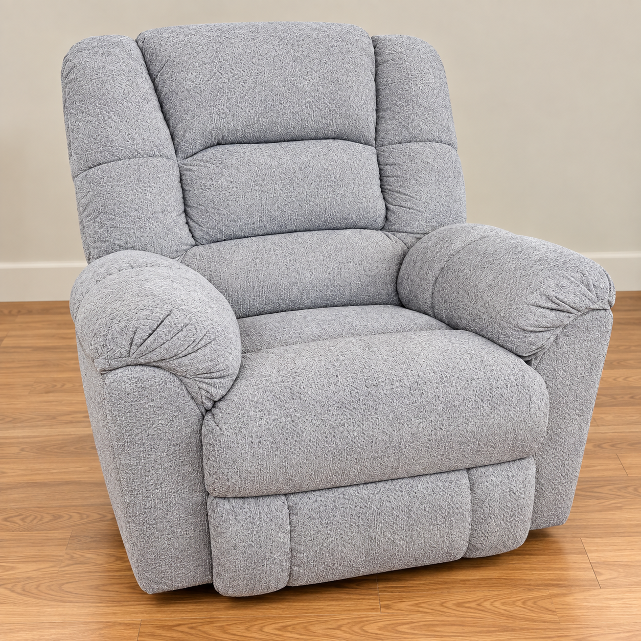 HomeStretch light gray plush recliner with tiered back cushions and generously rounded arms