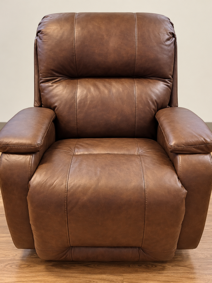 Best Home Furnishings brown recliner with contrast stitching, divided back and padded arm tops