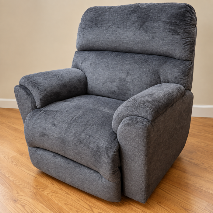Best Home Furnishings charcoal gray recliner with a broad split back and rounded padded arms