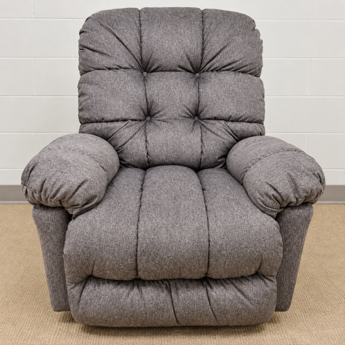 Best Home Furnishings gray recliner with a tufted back, pillow arms and segmented seat