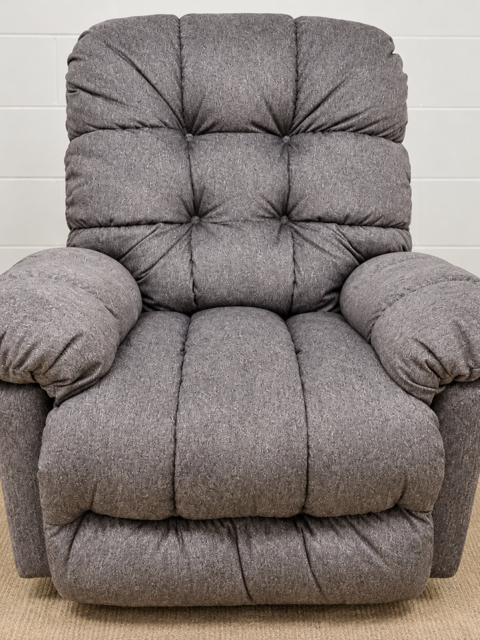 Best Home Furnishings gray recliner with a tufted back, pillow arms and segmented seat