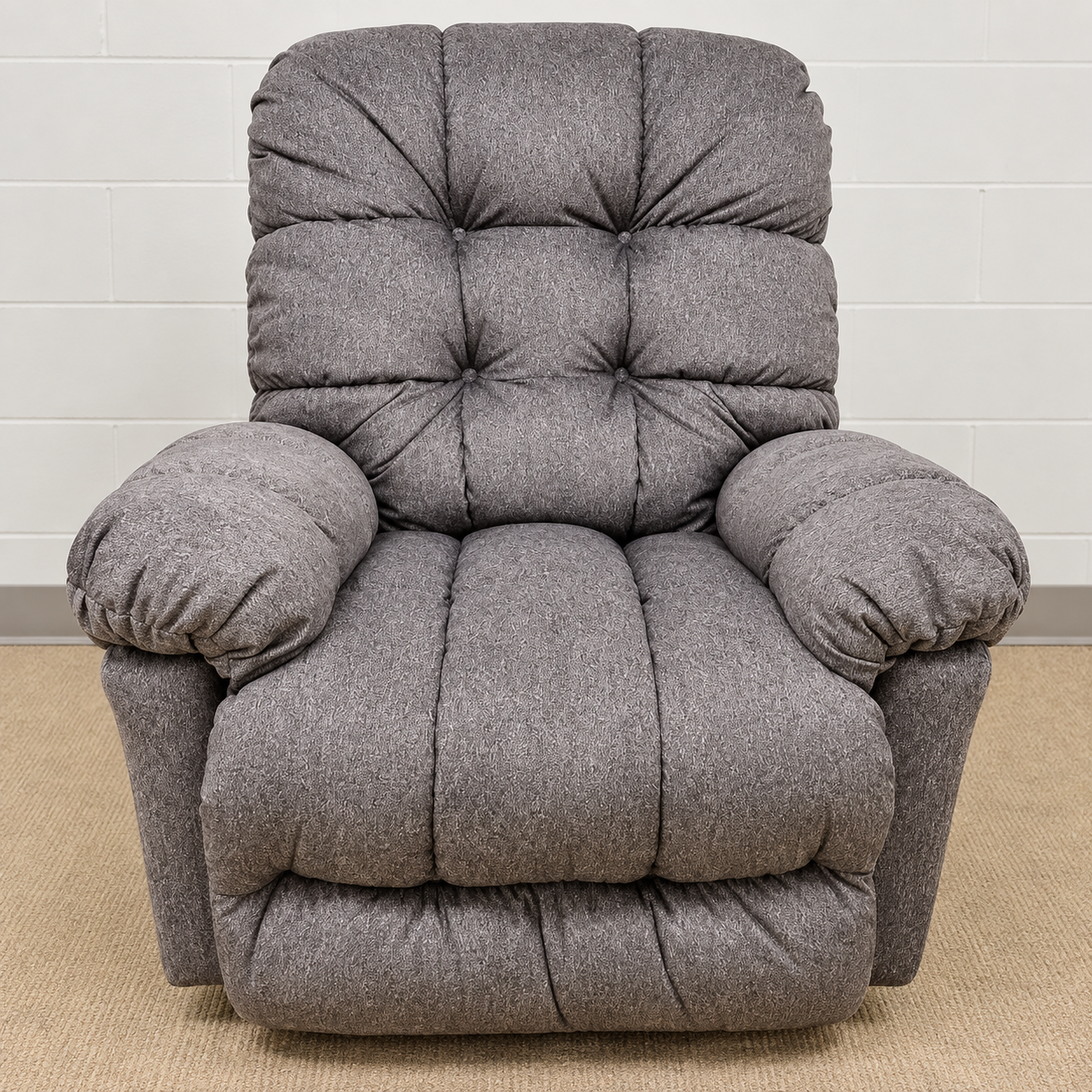 Best Home Furnishings gray recliner with a tufted back, pillow arms and segmented seat