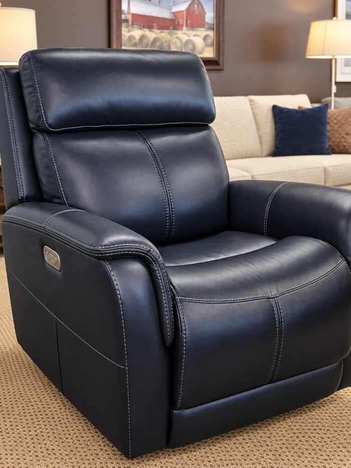 Flexsteel black power recliner with light contrast stitching, padded arms, and side controls