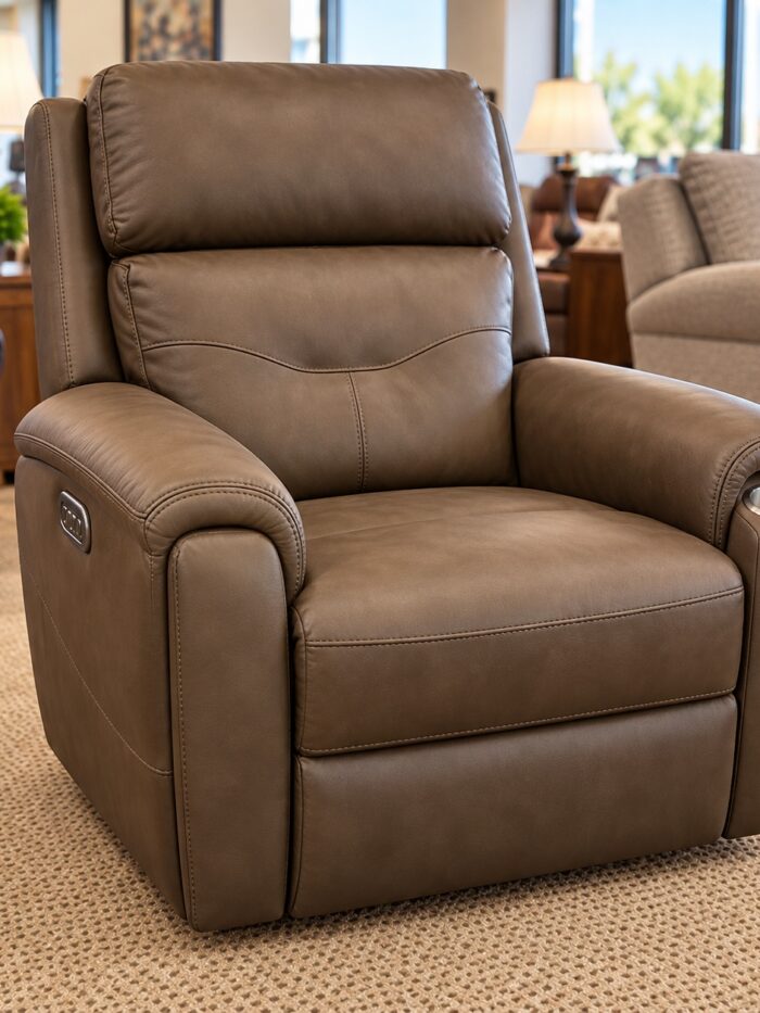 Flexsteel brown power recliner with a cupholder, padded arms, and side controls