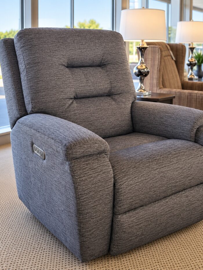 Flexsteel gray fabric power recliner with a segmented back, padded arms, and side controls