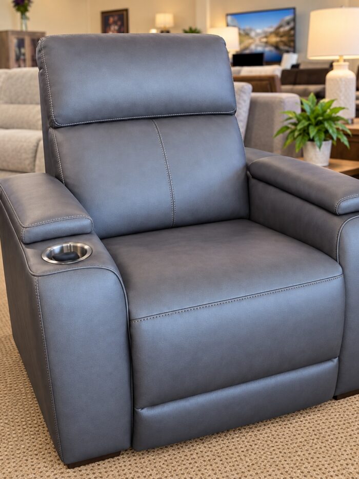 Flexsteel gray recliner with a cupholder, padded arm tops, and contrasting stitching