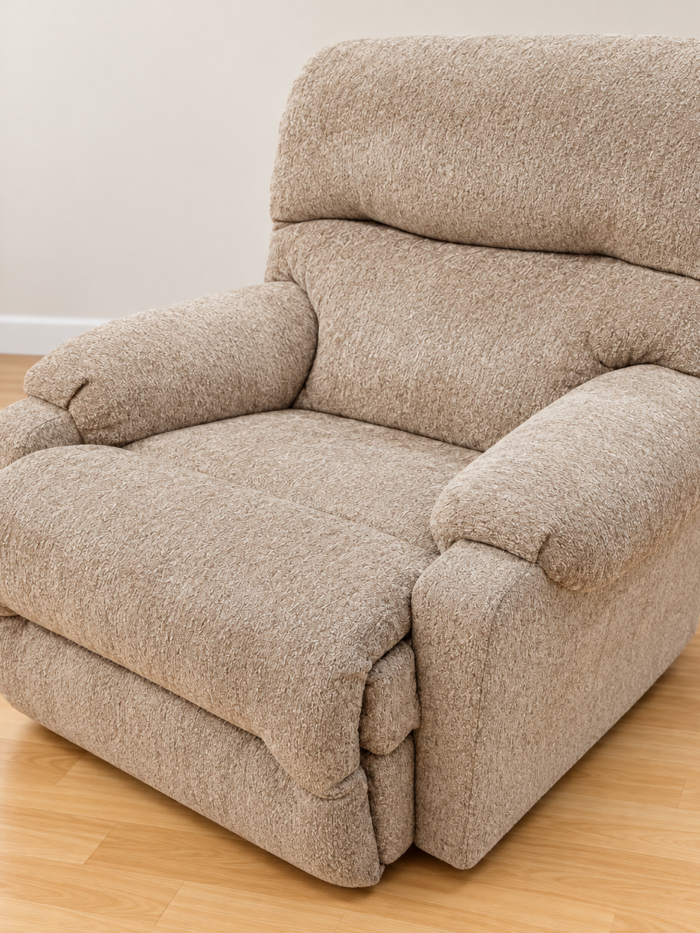Best Home Furnishings beige recliner with a split cushioned back and padded rounded arms